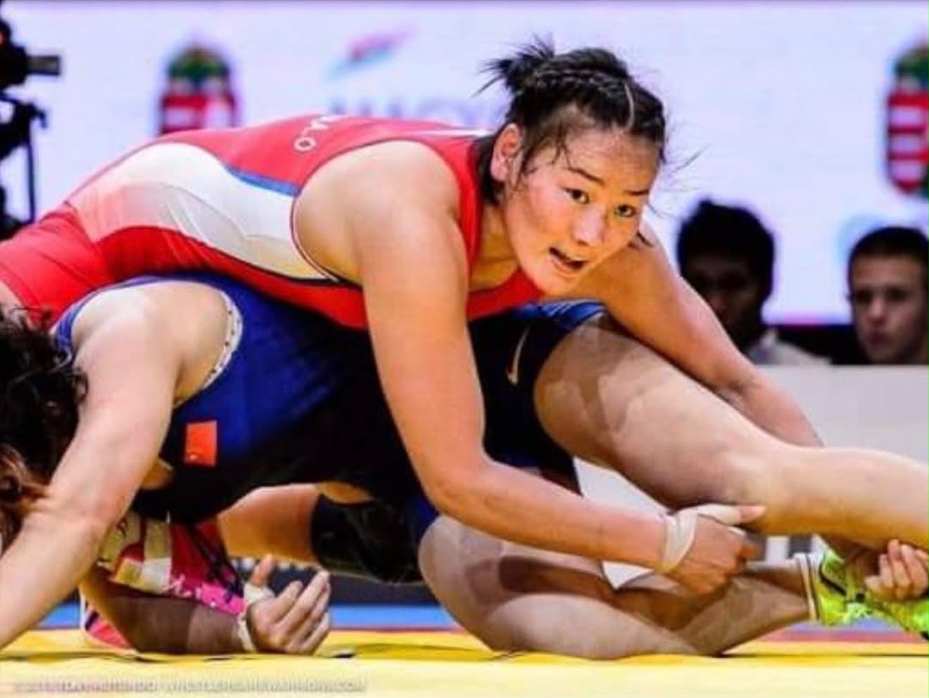 Coach Uka competing on the wrestling mat