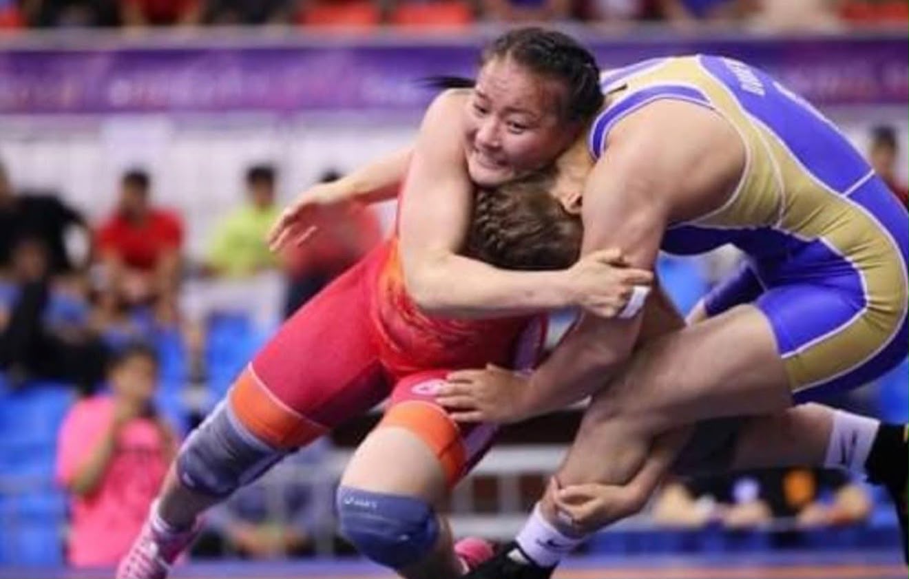 Coach Uka competing in a freestyle wrestling match