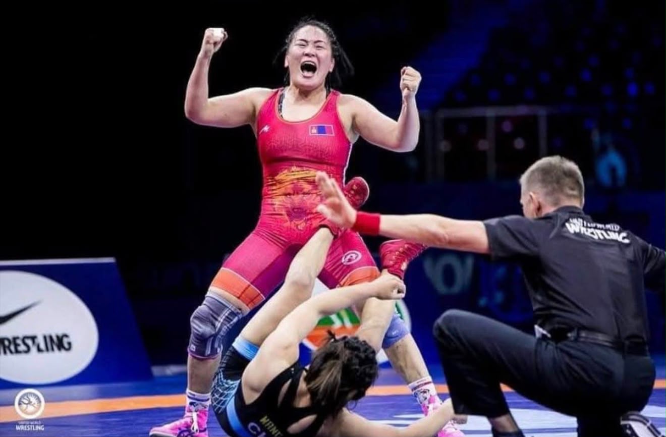 Coach Uka celebrating a freestyle wrestling victory